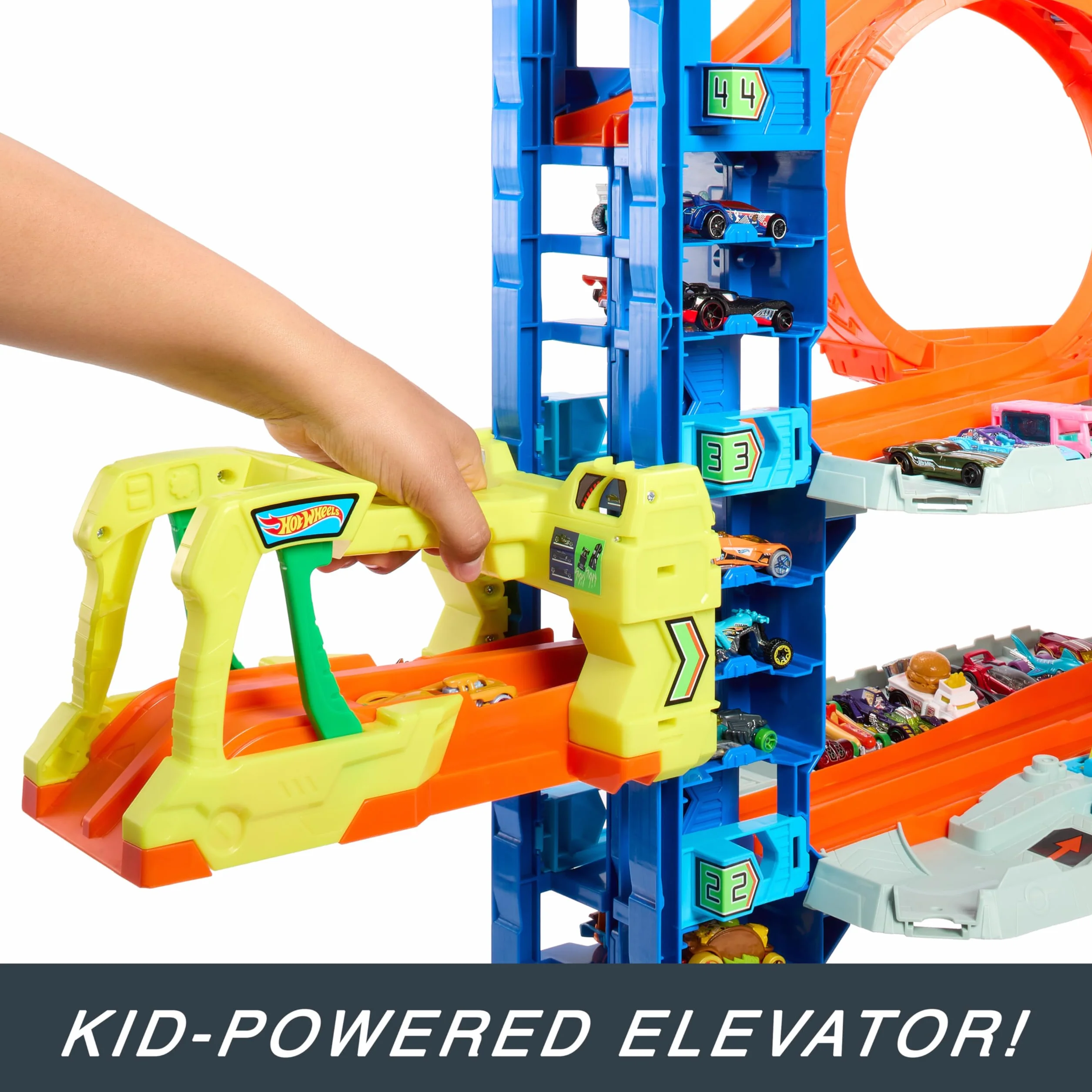 Hot Wheels City Mega Let's Race – Na start! - Netflix - Garaż Atak smoka Zestaw z 2 metalowymi samochodzikami, miejscem do przechowywania ponad 50 pojazdów w skali 1:64, HKX48